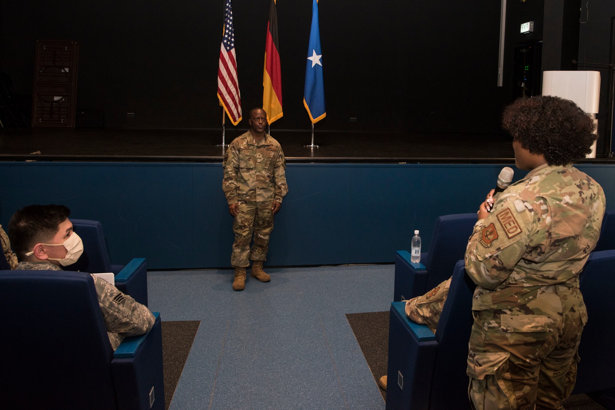 U.S. Air Force Senior Airman Teresa Atkins, 86th Medical Support Squadron pharmacy technician, asks a question to Brig. Gen. Ronald E. Jolly, Headquarters U.S. Air Forces in Europe – Air Forces Africa engineering and force protection director of logistics, during a forum.