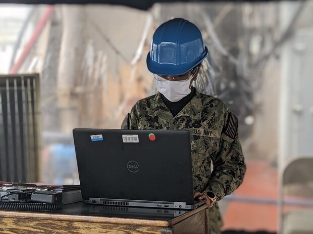 A sailor aboard the USS Tortuga (LSD-46) uses a damage control stand-alone laptop provided by Naval Surface Warfare Center, Philadelphia Division (NSWCPD) in the fight against COVID-19.  The laptop utilizes NSWCPD’s Advanced Damage Control System (ADCS), which provides crews aboard U.S. Navy vessels the capability to track personnel, plot boundaries around quarantined areas, and manage traffic throughout the ship. (U.S. Navy Courtesy Photo)