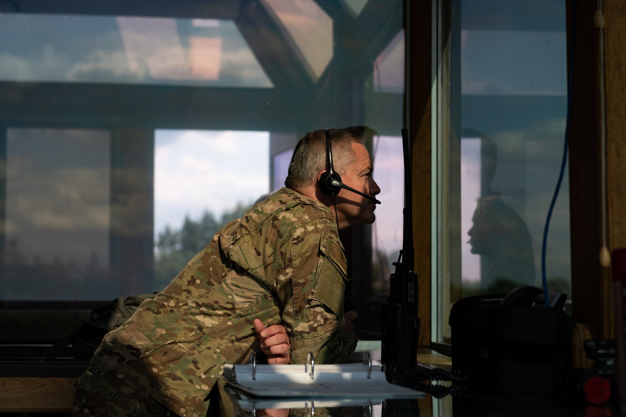 U.S. Air Force Senior Master Sgt. Bobby Norton, the superintendent of Detachment 1 of the 113th Air Support Operations Squadron, which is a unit of the 181st Intelligence Wing, observes aircraft maneuvers from a range control tower during a live-fire, air-to-ground exercise at Camp Atterbury Joint Maneuver Training Center, Ind., Aug. 6, 2020. Atterbury Range is one of three air ranges belonging to the Indiana Air Range Complex, which provides more than 1,600 acres worth of air range space for air crews and ground controllers to execute air support missions. (U.S. Air National Guard photo by Staff Sgt. Jonathan W. Padish)