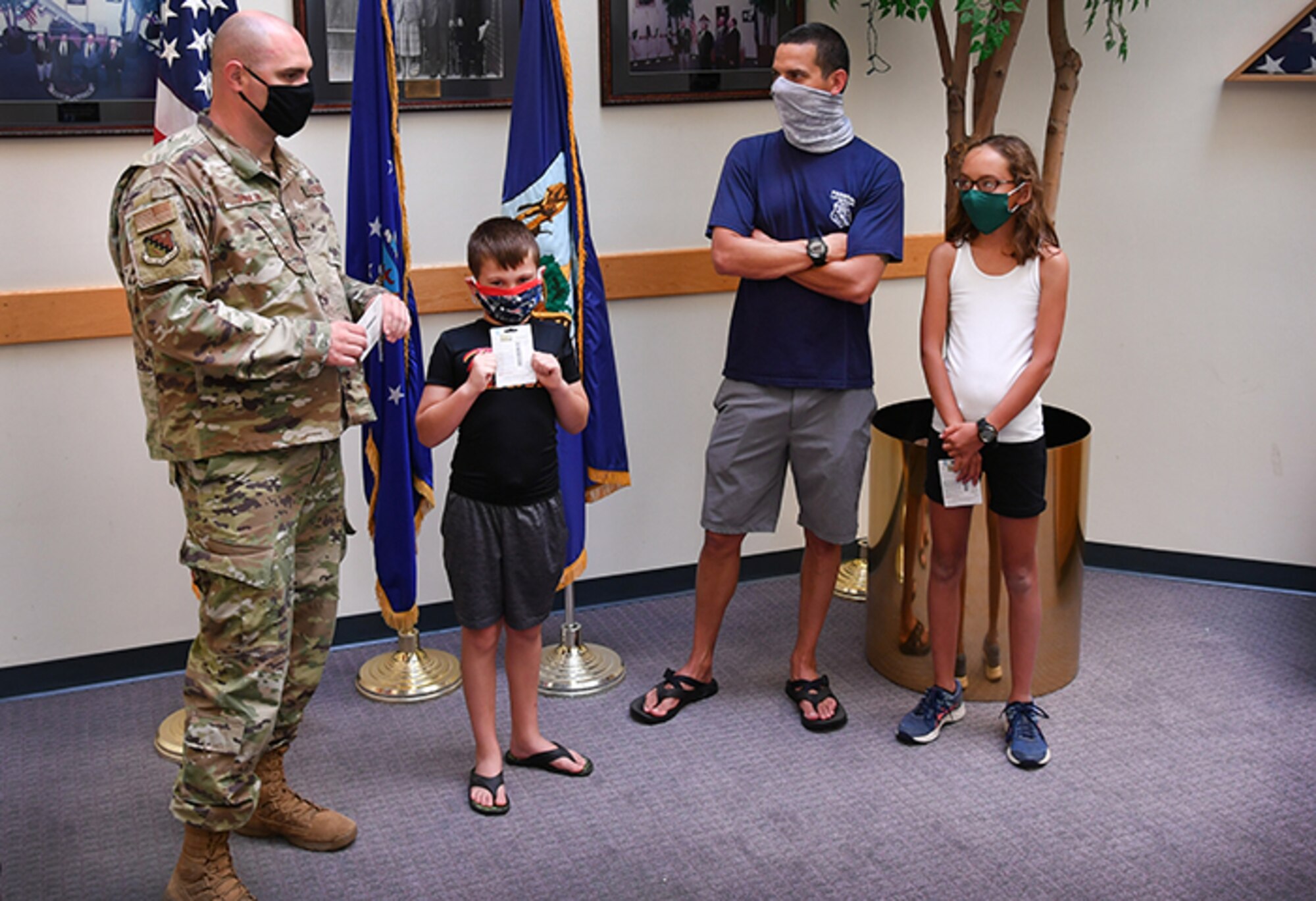Master Sgt. Anthony Poulin, 66th Air Base Group first sergeant, recognizes winners of a 31-day ‘Run-Walk-Cycle’ challenge at Hanscom Air Force Base, Mass., Aug. 11. The challenge invited anyone associated with the base to log miles they ran, walked or biked throughout the month of July to promote healthy and active lifestyles. (U.S. Air Force photo by Linda LaBonte Britt)