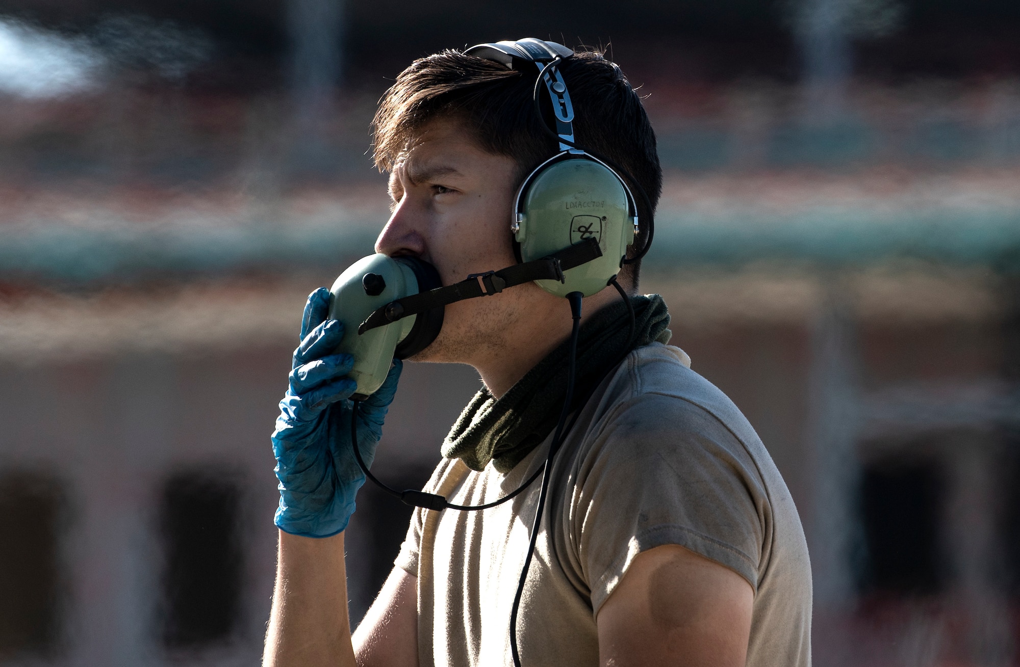 U.S. Air Force Airman 1st Class Tyler Thomas, 492nd Aircraft Maintenance Squadron crew chief, communicates with aircrew prior to take-offs at Royal Air Force Lakenheath, England, Aug. 7, 2020. 48th AMXS Airmen ensure Liberty Wing F-15s are fit to fly and can continue to provide superior airpower capabilities when called upon. (U.S. Air Force photo by Airman 1st Class Jessi Monte)