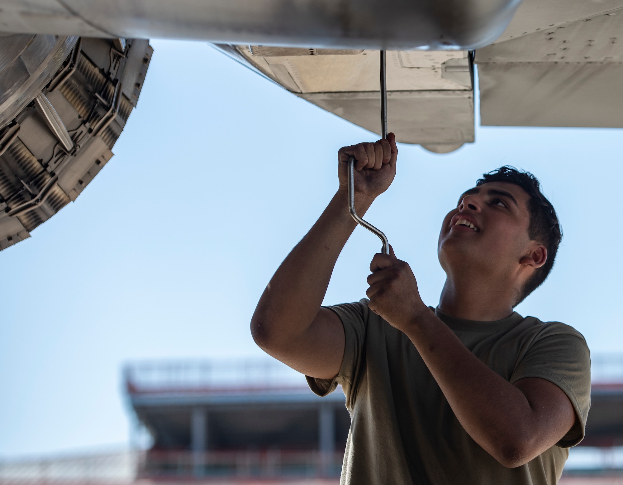 U.S. Air Force Senior Airman Darryon Rivera, 494th Aircraft Maintenance Unit crew chief, performs routine maintenance on an F-15E Strike Eagle at Royal Air Force Lakenheath, England, Aug 7, 2020. 48th AMXS Airmen ensure Liberty Wing F-15s are fit to fly and can continue to provide superior airpower capabilities when called upon. (U.S. Air Force photo by Airman 1st Class Jessi Monte)