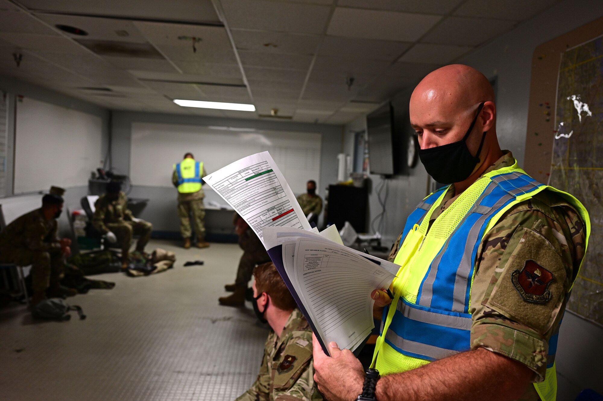 An Airman sorts through papers.