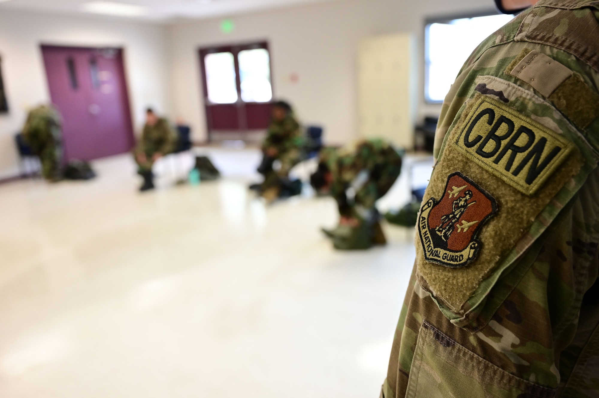 An Airmen instructs a CBRN class.