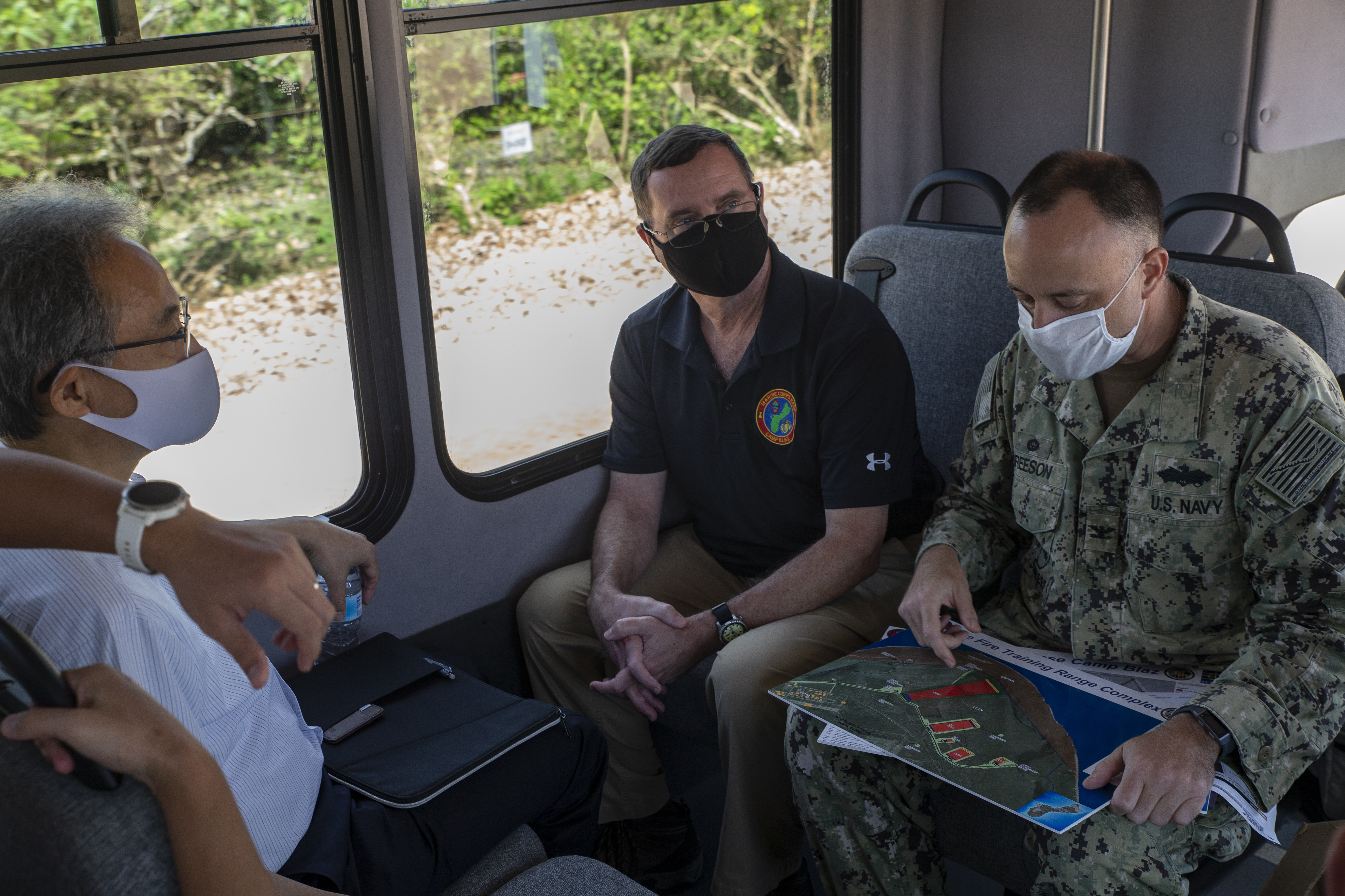 U.S. Navy Capt. Joe Greeson, the commanding officer of Officer in Charge of Construction (OICC), right, briefs Toshiaki Kobayashi, the Japanese Consulate General, left, on construction progress for the upcoming Marine Corps Base Camp Blaz, Guam, July 30, 2020.