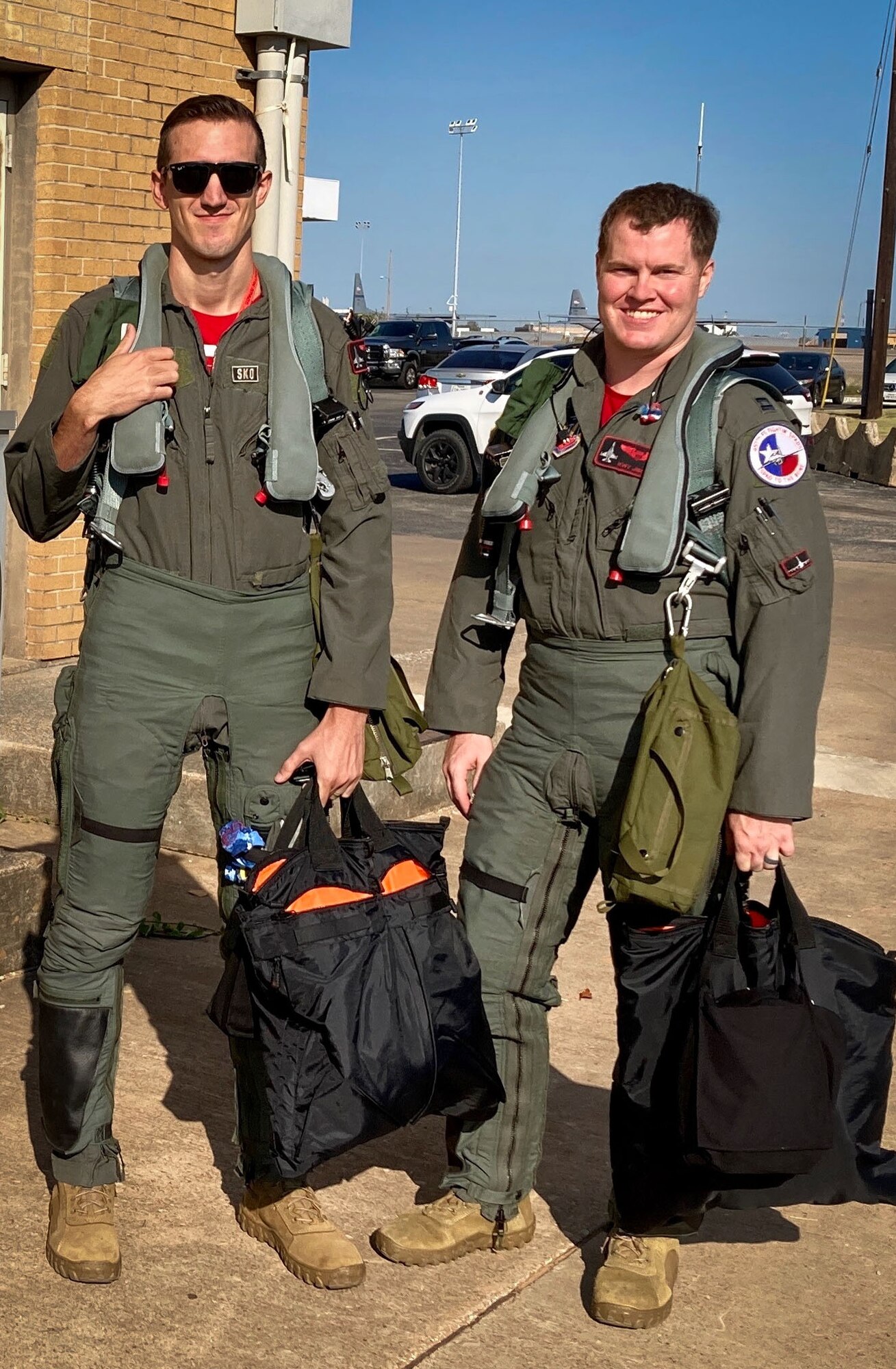 Two pilots from the 457th Fighter Squadron pause prior to performing a memorial flyover for POW and F-16 program founder, Brigadier General Lyle Cameron on August 7 at Dallas Fort Worth National Cemetery. The Spads of the 457 FS have been flying the F-16 Fighting Falcon for more than 25 years. (Courtesy photo)