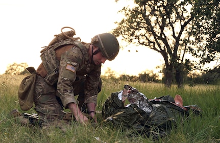 Combat Paramedic works in the field.