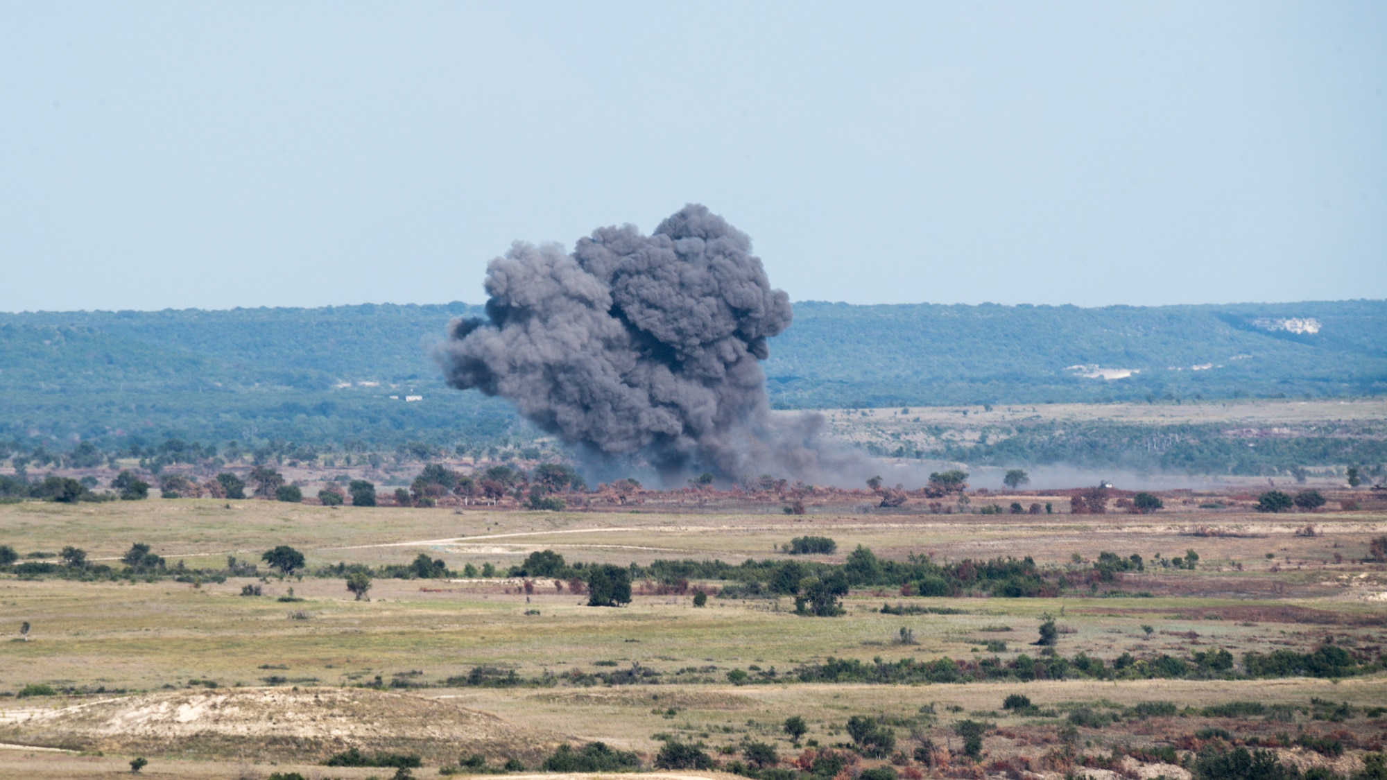 Dropped munitions create an explosion during Exercise Pegasus Forge at Fort Hood, Texas, Aug. 11, 2020. The event took 45 days in the field leading up to the last full day filled with a fires coordination exercise. (U.S. Air Force photo by Senior Airman Lillian Miller)