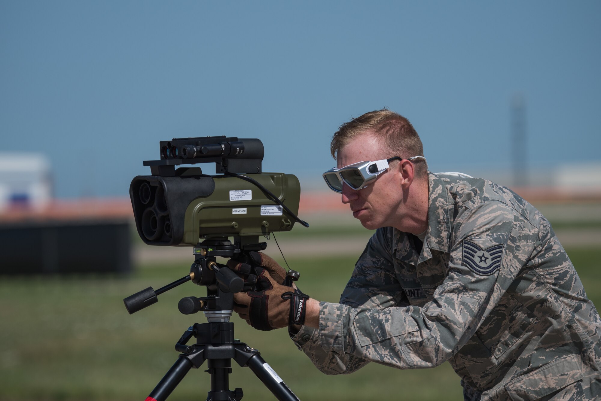 Tech. Sgt. Spencer Balint, 22nd Aircraft Maintenance Squadron laser safety officer, fires a laser into the Large Aircraft Infrared Counter-Measures system aboard the KC-46A Pegasus Aug. 11, 2020, at McConnell Air Force Base, Kansas. The laser fires into the LAIRCM to test the operational capabilities and its ability to detect infrared missiles. (U.S. Air Force photo by Airman 1st Class Marc A. Garcia)