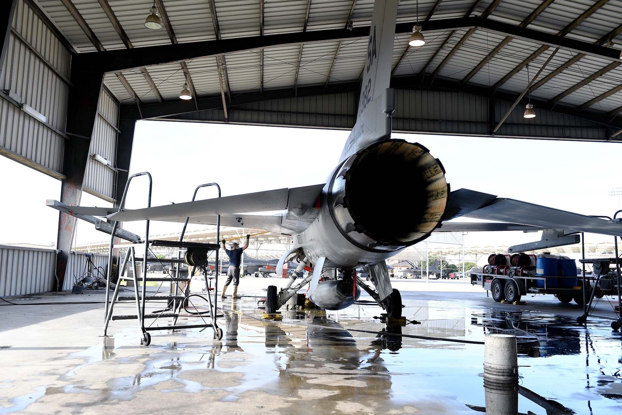 An F-16 Fighting Falcon, assigned to the Air National Guard's 149th Fighter Wing, receives a jet wash at Joint Base San Antonio-Lackland July 24.