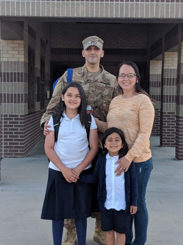 Master Sgt. Ya’acov Mosly, 21st Civil Engineering Squadron operations of engineering section chief stands with his wife, Andrea and daughters Emma, 10 and Lilly, 5.