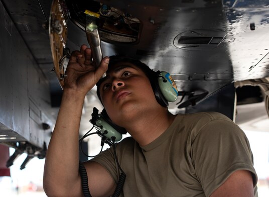 U.S. Air Force Senior Airman Darryon Rivera, 494th Aircraft Maintenance Unit crew chief, checks the fluid levels in an F-15E Strike Eagle at Royal Air Force Lakenheath, England, Aug. 7, 2020. 48th AMXS Airmen ensure Liberty Wing F-15s are fit to fly and can continue to provide superior airpower capabilities when called upon. (U.S. Air Force photo by Airman 1st Class Jessi Monte)