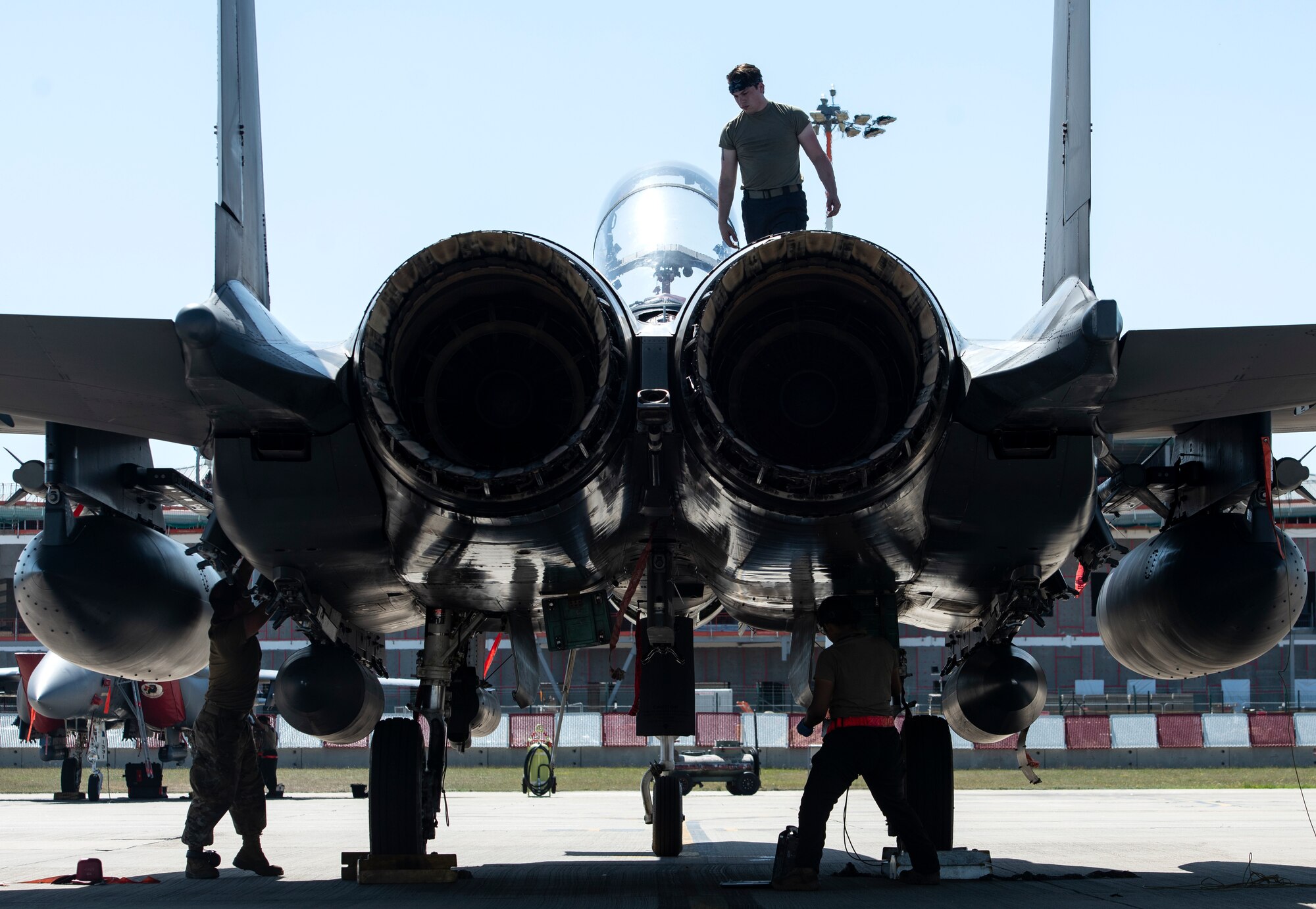 U.S. Air Force crew chiefs, assigned to the 48th Aircraft Maintenance Squadron, work together to recover an F-15E Strike Eagle at Royal Air Force Lakenheath, England, Aug. 7, 2020. 48th AMXS Airmen ensure Liberty Wing F-15s are fit to fly and can continue to provide superior airpower capabilities when called upon. (U.S. Air Force photo by Airman 1st Class Jessi Monte)