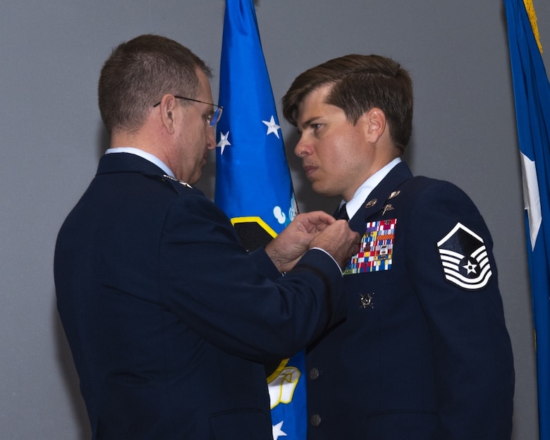 image of Master sergeant john grimesey receiving silver star medal from lieutenant general jim slife