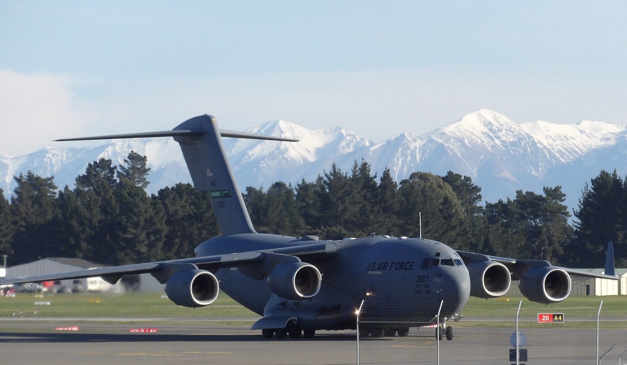 A C-17 Globemaster III from Joint Base Lewis-McChord, Wash., lands at the Christchurch Airport in Christchurch, New Zealand, Aug. 7, 2020. Before conducting the Operation Deep Freeze mission, air crew and personnel from Joint Base Lewis-McChord must go through a 14-day quarantine to mitigate the spread of COVID-19 and maintain Antarctica as the only continent that hasn’t had a case of the virus. (Courtesy photo by Ron Rogers)