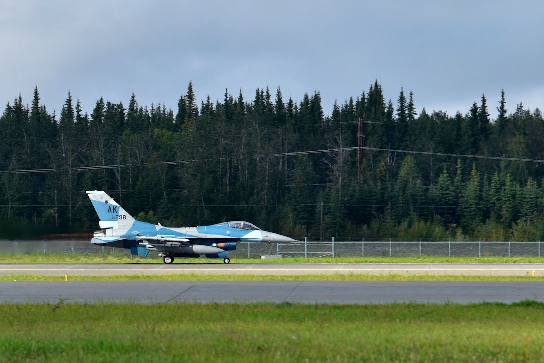 An F-16 Fighting Falcon from the 18th Aggressor Squadron takes off during RED FLAG-Alaska 20-3 on Eielson Air Force Base, Alaska, Aug. 13, 2020. The 18th AGRS mission during RF-A 20-3 is to know, teach, and replicate adversary threats while engaging in simulated air-to-air combat. (U.S. Air Force photo by Senior Airman Beaux Hebert)