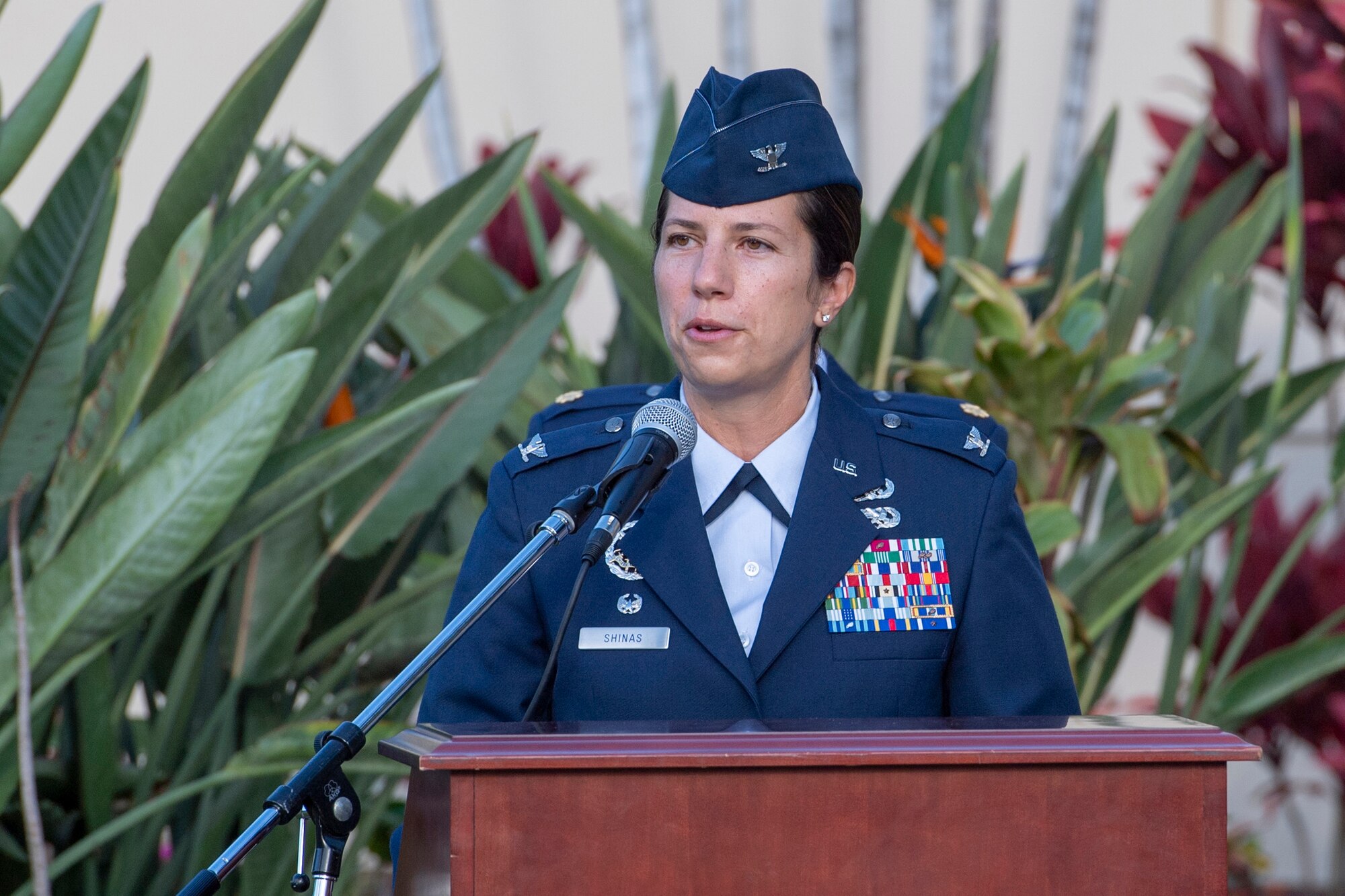 A photo of U.S. Air Force Col. Athanasia Shinas, 624th Regional Support Group commander, speaking to audience members during the 624th Aeromedical Staging Squadron change of command ceremony in front of the 15th Medical Group building at Joint Base Pearl Harbor-Hickam, Hawaii, Aug. 8, 2020.