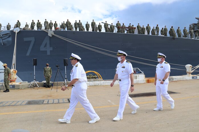 Capt. Christopher Follin, commodore, Destroyer Squadron Two, Cmdr. Rusty J. Williamson and Cmdr. Bobby J. Rowden attend the change-of-command ceremony for the guided-missile destroyer USS McFaul (DDG 74).