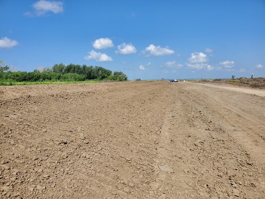 Long stretch of Breach C is seen with dirt displaying tracks from hauling equipment.