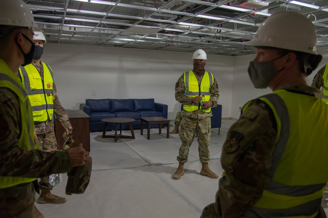 Leadership from the 379th Air Expeditionary Wing discuss quality of life for dorm residents at Al Udeid Air Base, Qatar, Aug. 11, 2020. The construction at Al Udeid is a Qatar-led, funded, and executed project to build 10 state-of-the-art dormitories, two dining facilities, and three mission support facilities slated for completion in the near future in an effort to increase quality of life for the service members at the installation. The 379th Expeditionary Mission Support Group leadership and those involved in this project brought Airmen to the dorm to get feedback on the layout and furniture to ensure it meets their needs.