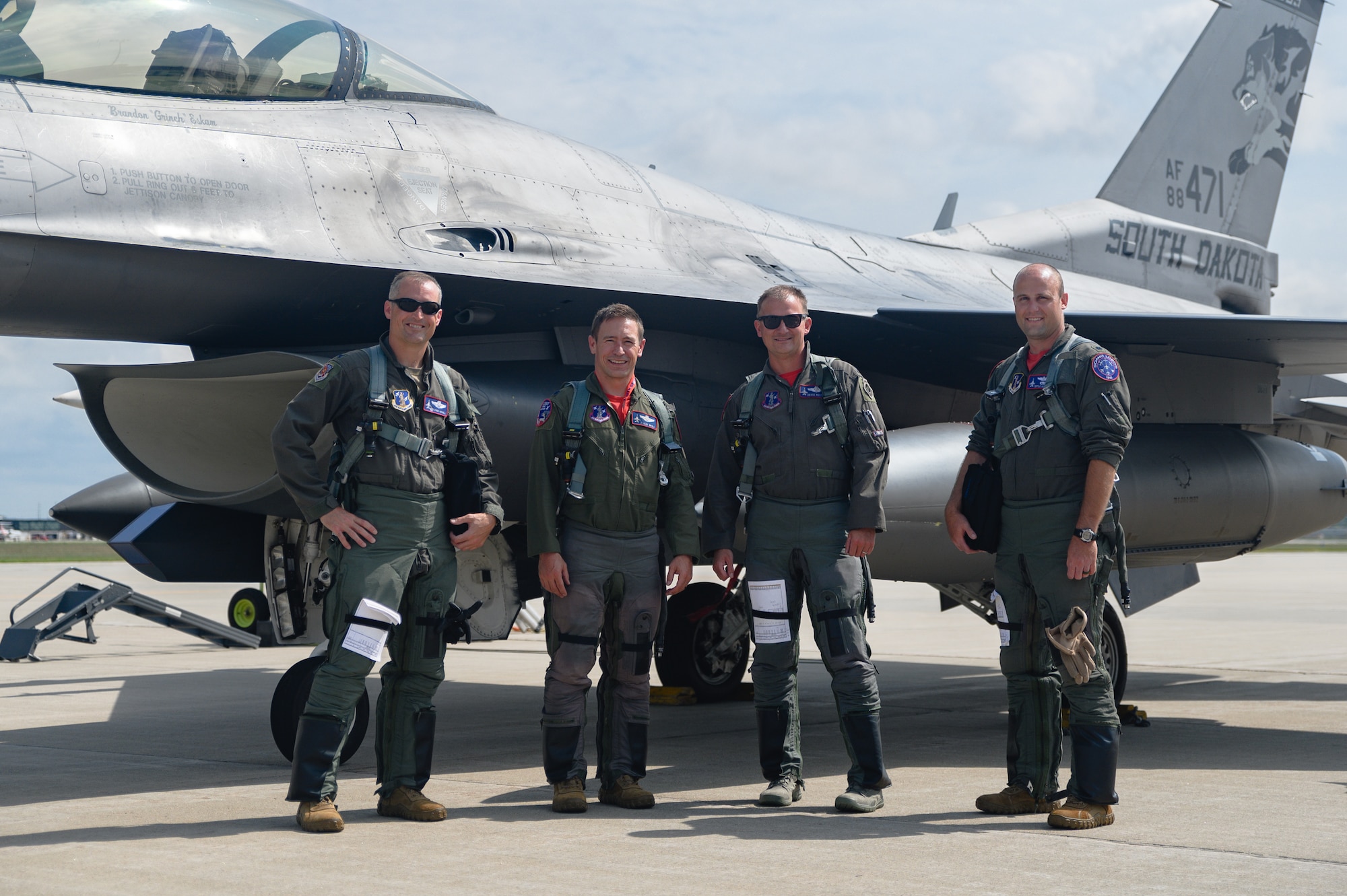 Col. Cory Kestel, 114th Operations Group commander, poses for a photo with Col. Mark Morell, 114th Fighter Wing commander, Lt. Col. Josh Wika, 175th Fighter Squadron commander, and Lt. Col. Steven Schultz, 114th Operations Group chief of standard evaluation, after completing 3000 flight hours at Joe Foss Field, S.D., Aug. 14, 2020.