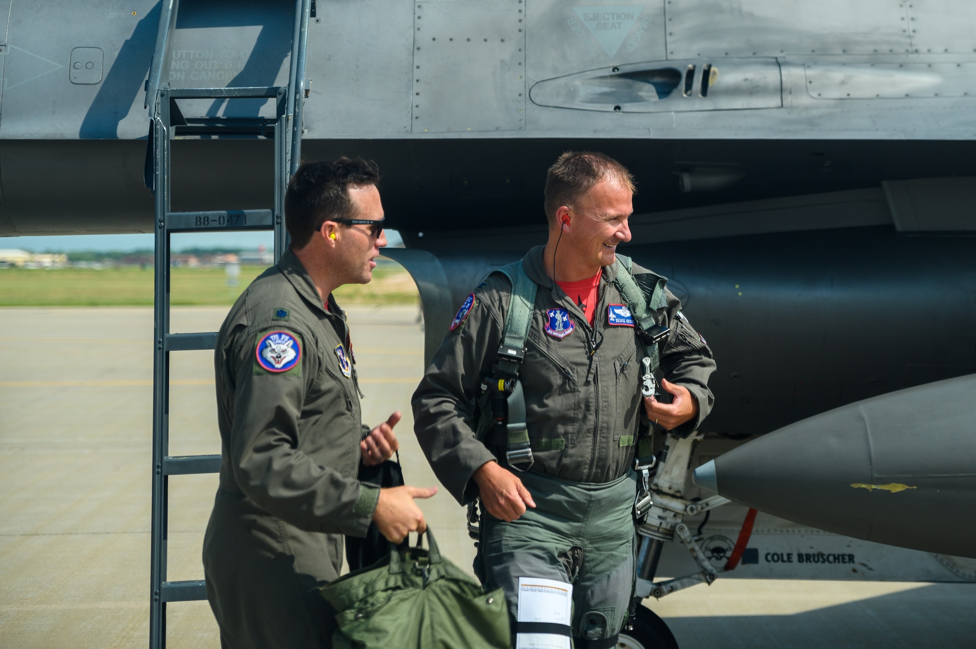 Col. Cory Kestel,114th Operations Group commander, is greeted by Lt. Col. Jeremy Doohen, 114th Operations Support Squadron director of operations, after landing his 3000 hour flight at Joe Foss Field, S.D., Aug. 14, 2020