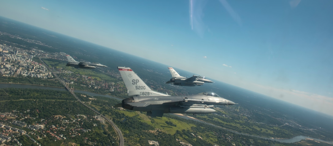 U.S. Air Force F-16 Fighting Falcons, assigned to the 480th Expeditionary Fighter Squadron, participate in a flyover during Polish Armed Forces Day at Warsaw, Poland, August 15,2020.  Participation in the Polish Armed Forces Day is one of several ways the U.S. is continuing to work with Polish allies to strengthen U.S. and Polish defense relations, NATO unity and transatlantic security. (U.S. Air Force photo by Senior Airman Chanceler Nardone)