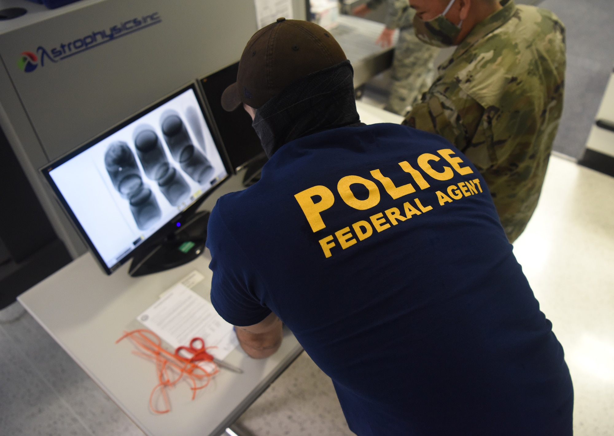 An Air Force Office of Special Investigations agent uses an X-ray scanner during an AFOSI-led good order and discipline search at RAF Mildenhall, England, July 27, 2020. AFOSI agents assigned to Detachment 512 work around-the-clock to identify, detect, deter and neutralize threats. (U.S. Air Force photo by Senior Airman Brandon Esau)