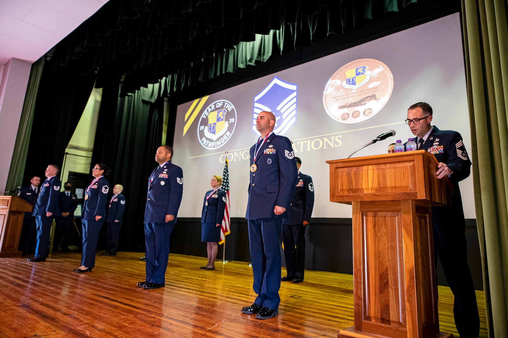 Chief Master Sgt. Kevin Miner, right, 422d Communications Squadron superintendent, speaks during a Senior noncommissioned officer induction ceremony at RAF Alconbury, England, Aug. 14, 2020. The event honored and celebrated the Airmen who have earned the rank of Master Sgt. (U.S. Air Force photo by Senior Airman Eugene Oliver)