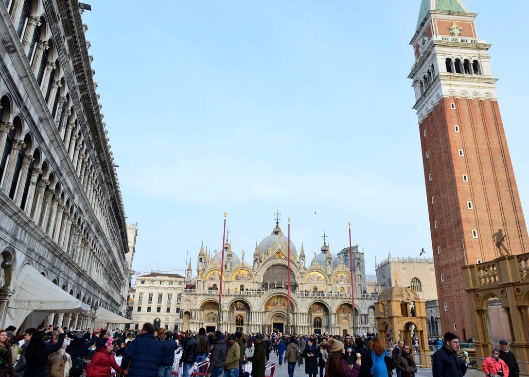 Crowds of people walk through the St. Mark’s Square in Venice, Italy. The square has been the city center for centuries and houses St. Mark’s Basilica, St. Mark’s Campanile, and Doge’s Palace. (U.S. Air Force photo by Staff Sgt. Carey Smith)