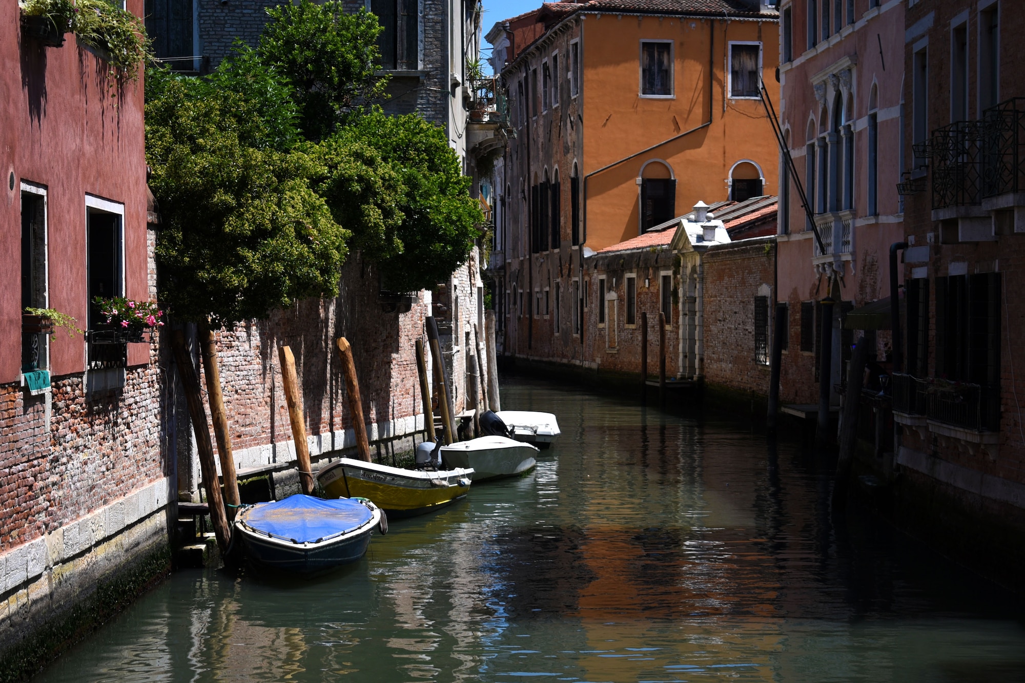 Boats line a canal in Venice, Italy. Venice is made up of tiny islands and connected by bridges and walkways. There are 150 canals in Venice which makes traveling across the water a popular choice. (U.S. Air Force photo by Staff Sgt. Kelsey Owen)