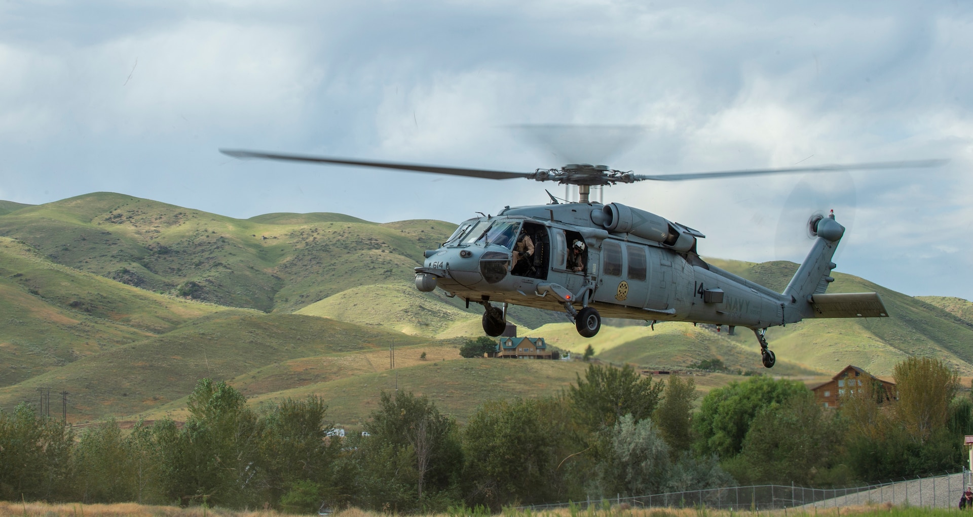 Idaho Air National Guard special warfare tactical air control party Airmen from the 124th Air Support Operations Squadron conduct non-combatant evacuation operation training in Horseshoe Bend, Idaho, Aug. 12, 2020, with members of the Navy’s Helicopter Sea Combat Squadron Four from North Island Naval Air Station, California. The joint training utilized HSC-4’s MH-60S Seahawk helicopters.
