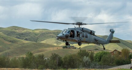 Idaho Air National Guard special warfare tactical air control party Airmen from the 124th Air Support Operations Squadron conduct non-combatant evacuation operation training in Horseshoe Bend, Idaho, Aug. 12, 2020, with members of the Navy’s Helicopter Sea Combat Squadron Four from North Island Naval Air Station, California. The joint training utilized HSC-4’s MH-60S Seahawk helicopters.