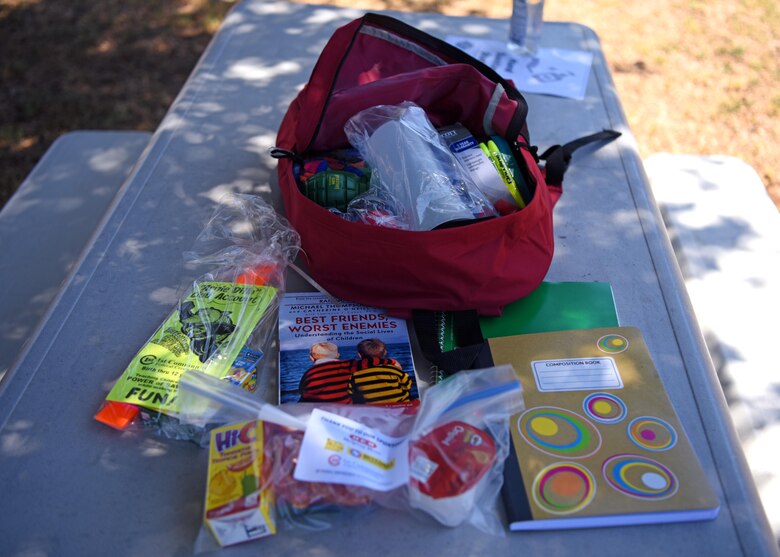 A backpack is open on the table displaying the contents bought for Operation Back to School on Goodfellow Air Force Base, Texas, Aug. 12, 2020. The supplies are intended to assist families with preparing their children for school. (U.S. Air Force photo by Airman 1st Class Ethan Sherwood)