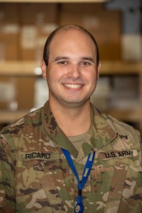 New Hampshire National Guard Spc. David Ricard of the 160th Engineer Detachment, shown Aug. 5, 2020, and other Guard members help the Department of Health and Human Services in Concord pack thousands of COVID-19 testing kits for the state of New Hampshire each day.