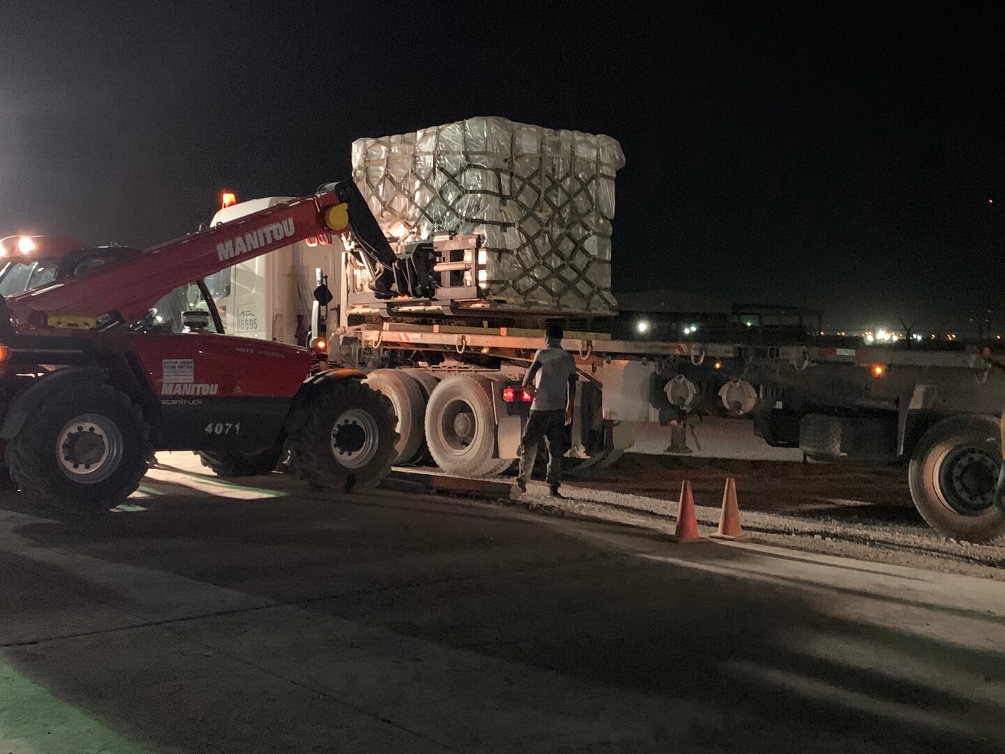Personnel from the 1st Theater Sustainment Command executed night operations at Camp Arifjan, Kuwait, Aug. 5, 2020, in response to the Lebanon tragedy. 1st TSC Soldiers and contractors immediately responded to the crisis in Lebanon by packing supplies for transportation to a nearby flight line.