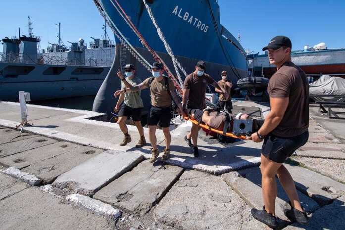 200803-N-RH019-0006 CONSTANTA, Romania, (Aug. 3, 2020) United States Navy Explosive Ordinance Disposal Mobile Unit 8 conducts emergency evacuation procedures during Eurasian Partnership Mine Countermeasures (EP MCM) 2020 exercise, August 3, 2020. The drill was to test evacuation from a Rigid Hull Inflatable Boat. EPMCM is a multi-lateral engagement with U.S., Romanian and Bulgarian forces, focused on enhancing mine countermeasure operations in the Black Sea, while strengthening interoperability between allied forces. U.S. 6th Fleet, headquartered in Naples, Italy, conducts the full spectrum of joint and naval operations, often in concert with allied, joint, and interagency partners, in order to advance U.S. national interests and security and stability in Europe and Africa. (U.S. Navy photo by Mass Communication Specialist 2nd Class Sean Rinner)