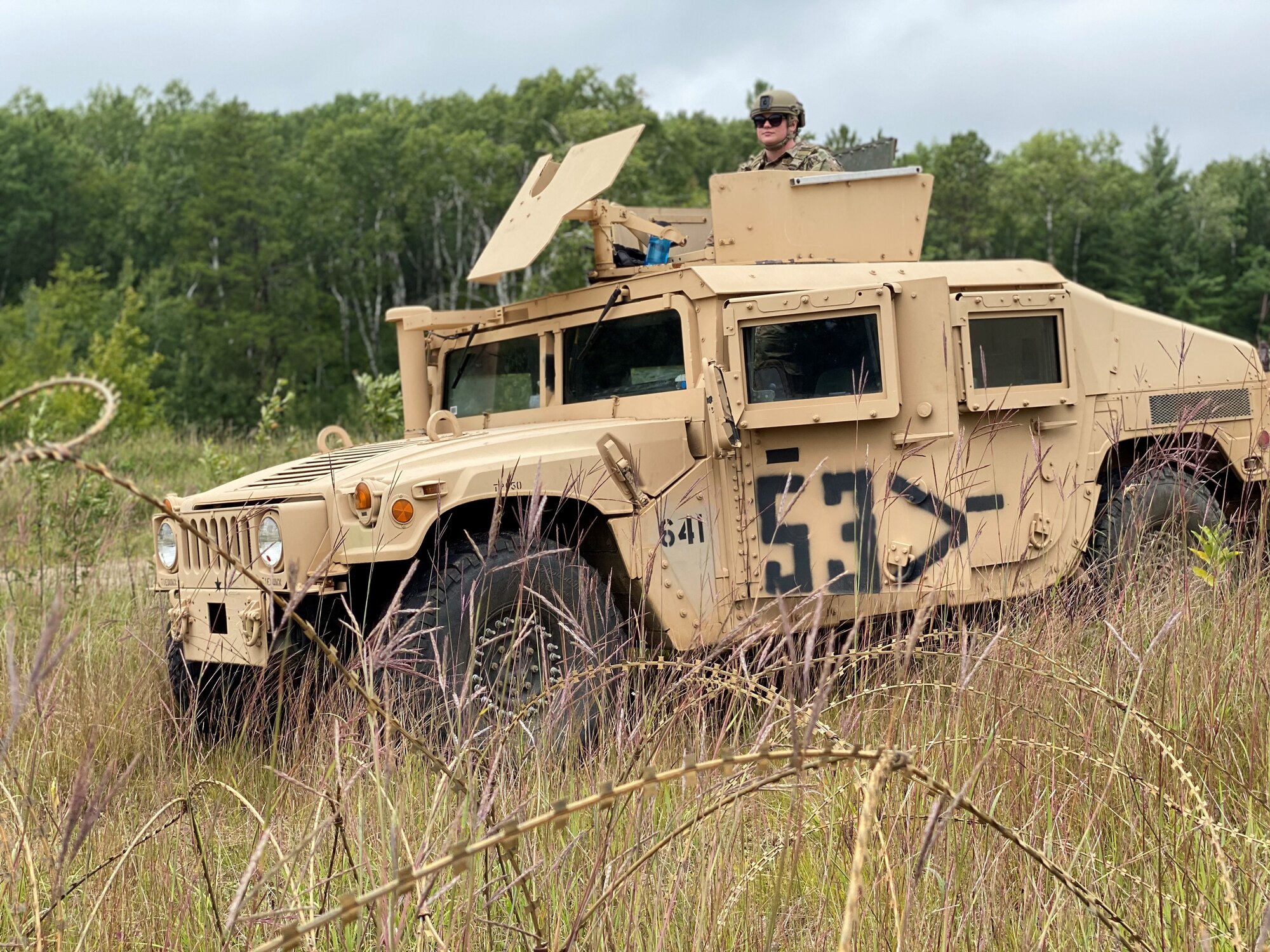 Airmen from the 148th Security Forces Squadron patrol a simulated forward operating base during a field training exercise (FTX) at Camp Ripley Training Center, Minnesota on August 13, 2020.