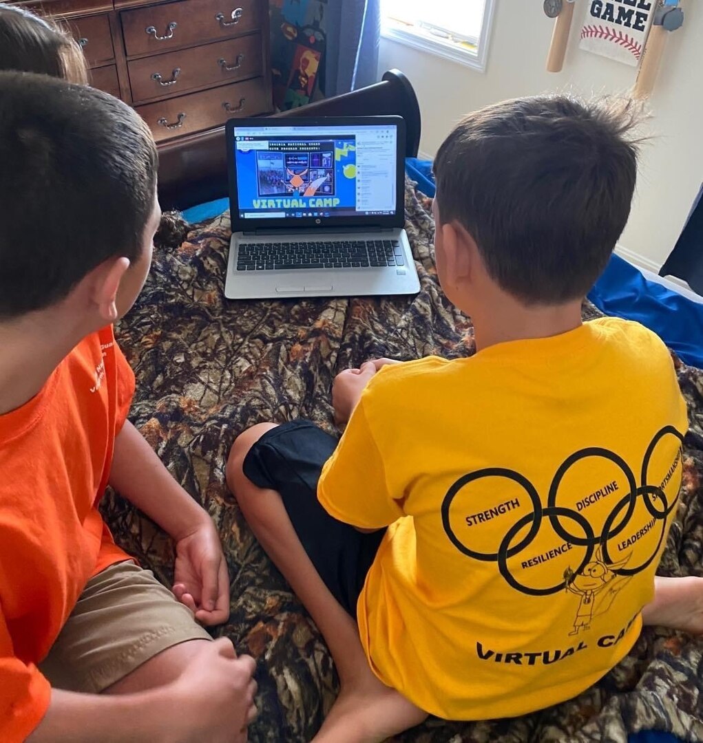 Campers sit and get ready to watch a live stream session during the Virginia National Guard Youth Program’s Virtual Summer Camp July 29, 2020. Fifty-three campers and 11 National Guard teens participated in the week-long, online experience.