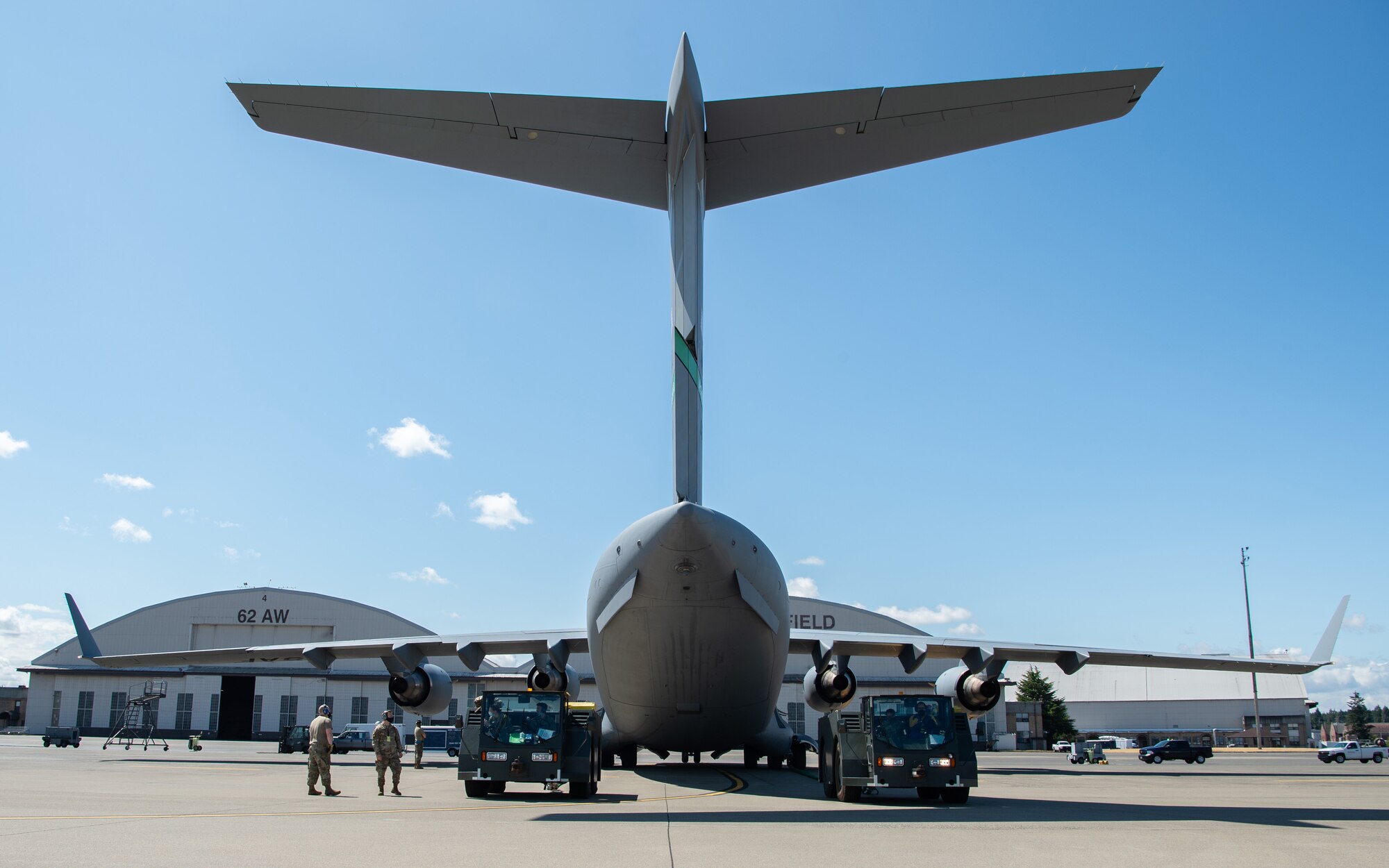 The 62nd Maintenance Squadron Crash Damaged or Disabled Aircraft Recovery team tow a simulated damaged C-17 Globemaster III during Exercise Long Hammer/Rainier War at Joint Base Lewis-McChord, Wash., Aug. 10, 2020. Exercises like this maintain Team McChord’s readiness to deploy and operate anywhere anytime. (U.S. Air Force photo by Senior Airman Tryphena Mayhugh)
