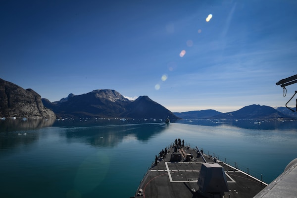 Royal Danish Navy Thetis-class frigate HDMS Triton (F358), front, and the Arleigh Burke-class guided-missile destroyer USS Thomas Hudner (DDG 116) transit Godthab Fjord.