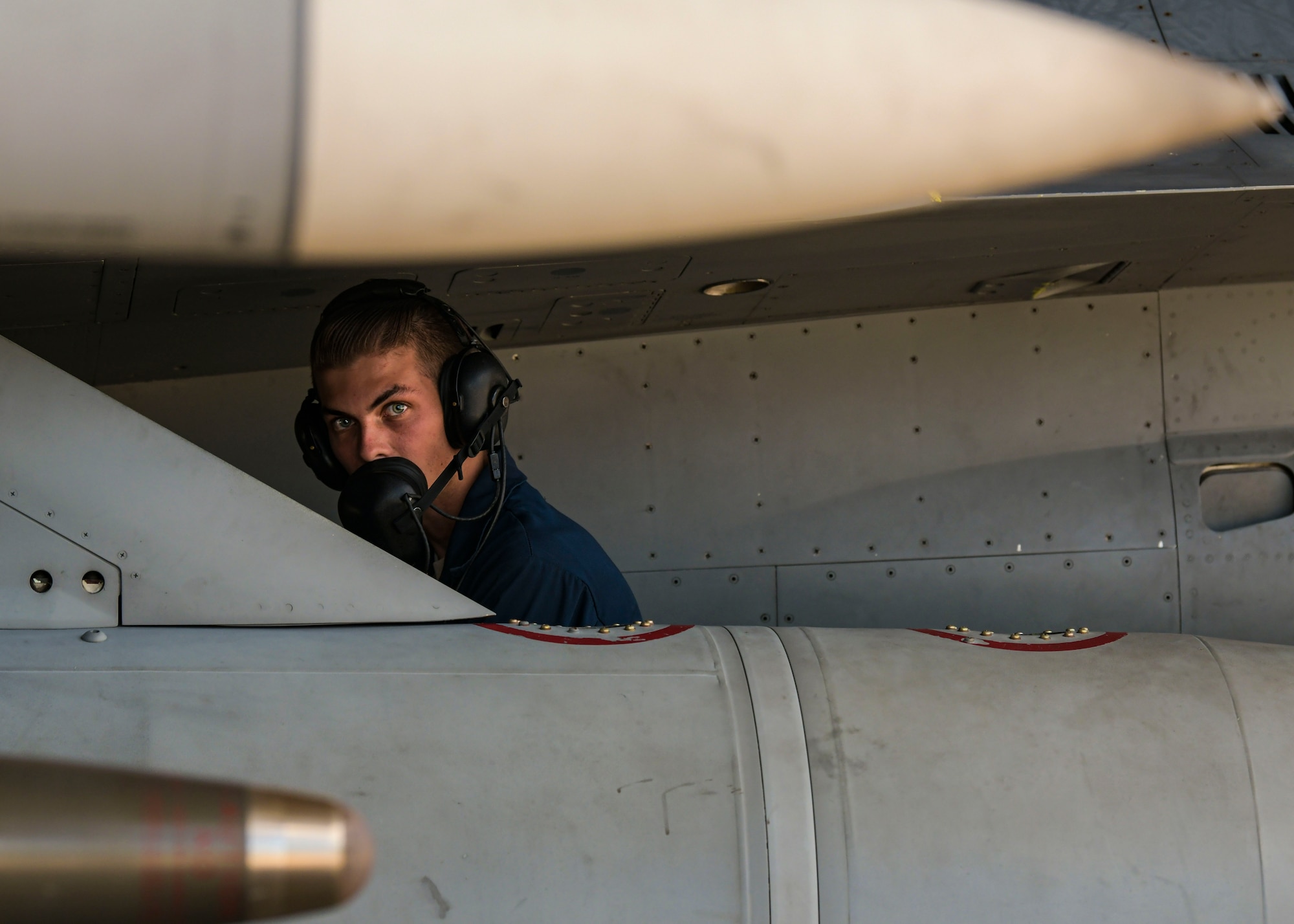 Airman walks on flightline.