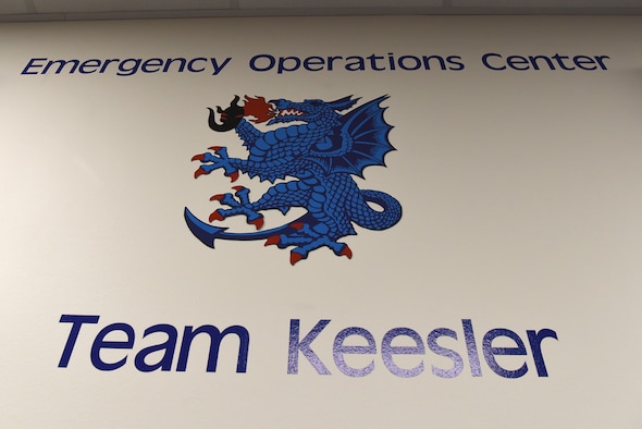 The Emergency Operations Center sign is displayed inside Wolfe Hall at Keesler Air Force Base, Mississippi, Aug. 14, 2020. EOCs are comprised of different emergency support functions such as comptrollers, public health, medical, contracting, emergency managers and more. (U.S. Air Force photo by Senior Airman Suzie Plotnikov)