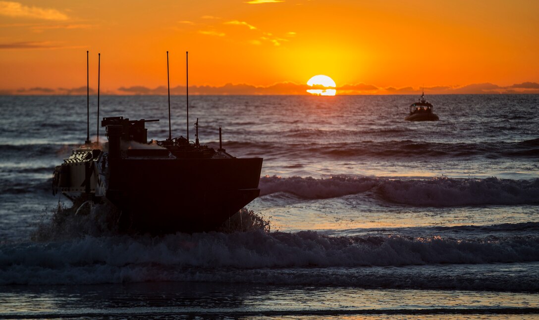 U.S. Marines with Amphibious Vehicle Test Branch, Marine Corps Tactical Systems Support Activity, drive a new Amphibious Combat Vehicle ashore during low-light surf transit testing at AVTB Beach on Marine Corps Base Camp Pendleton, California, Dec. 18, 2019.
