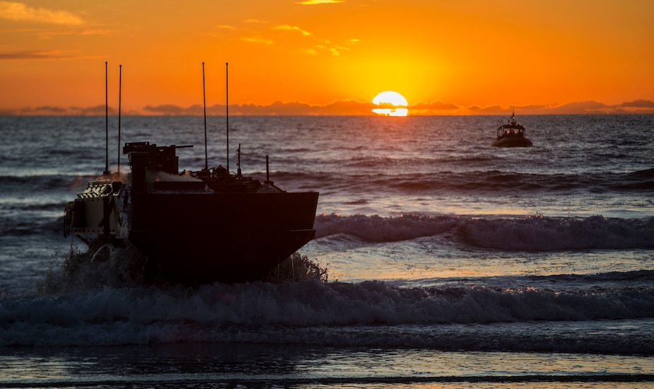 U.S. Marines with Amphibious Vehicle Test Branch, Marine Corps Tactical Systems Support Activity, drive a new Amphibious Combat Vehicle ashore during low-light surf transit testing at AVTB Beach on Marine Corps Base Camp Pendleton, California, Dec. 18, 2019.