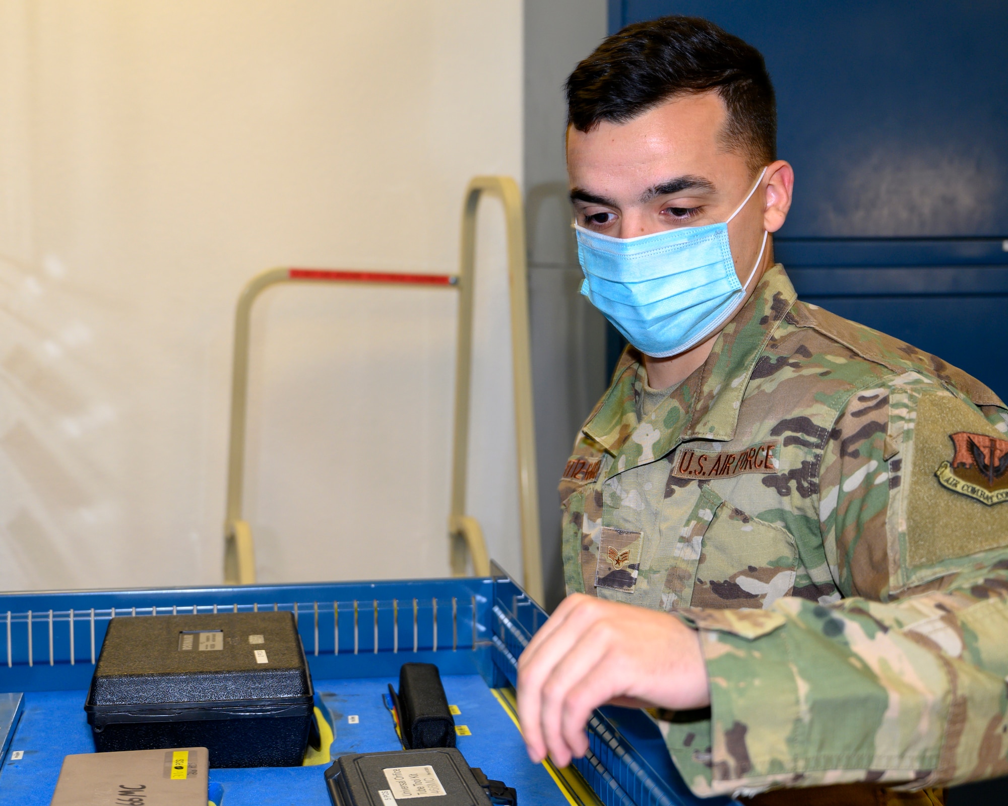 An Airman inspects vehicle maintenance tools.