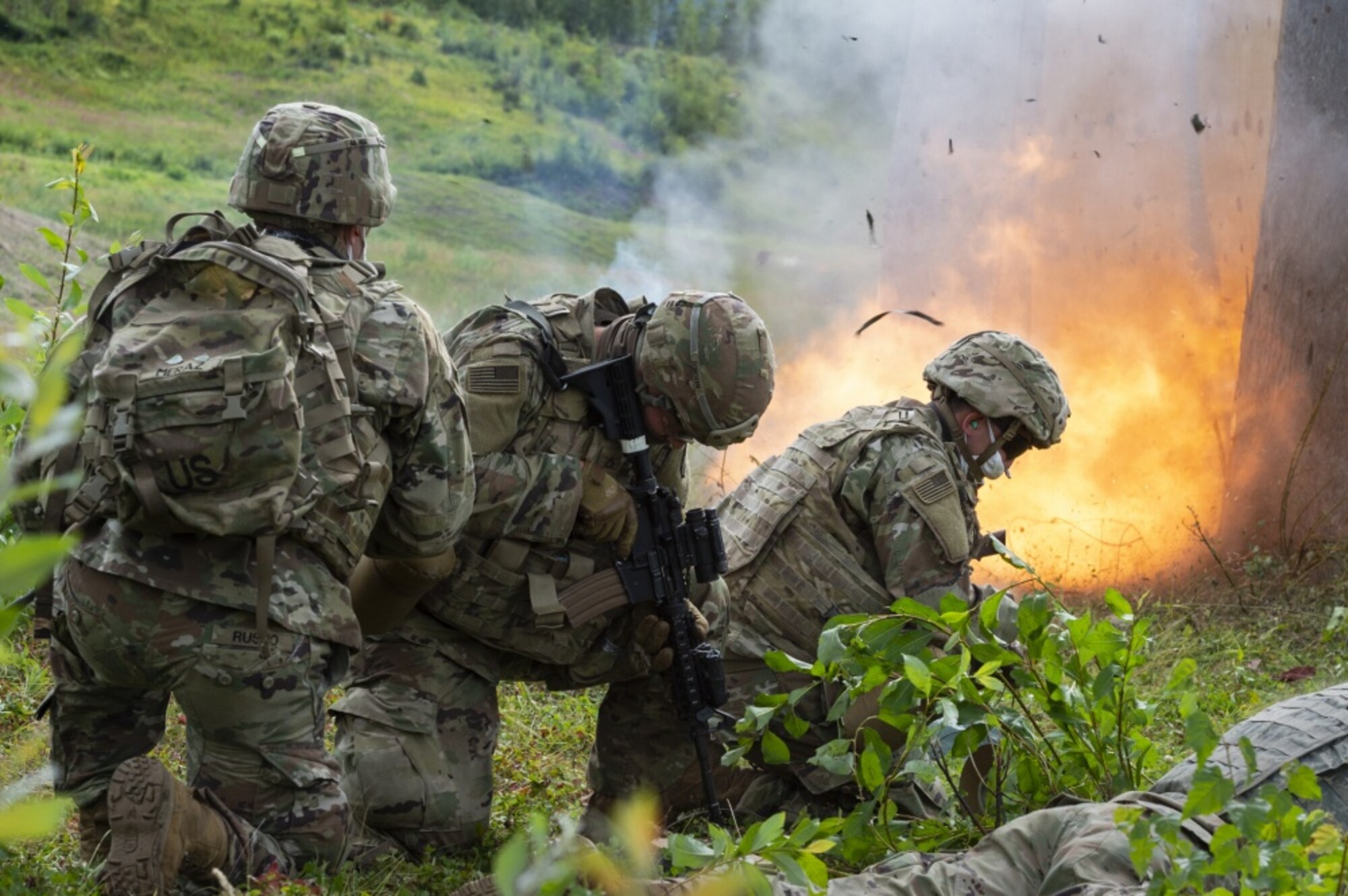 Combat engineers assigned to Sapper Company, 6th Brigade Engineer Battalion (Airborne), 4th Infantry Brigade Combat Team (Airborne), 25th Infantry Division, U.S. Army Alaska, utilize a controlled detonation to breach a simulated enemy position during live-fire training on the Infantry Squad Battle Course at Joint Base Elmendorf-Richardson, Alaska, Aug. 12, 2020. The Soldiers focused on honing core ground combat skills such as fire team movement, communication, breaching and destroying simulated enemy positions by assault and maneuver. (U.S. Air Force photo by Alejandro Peña)