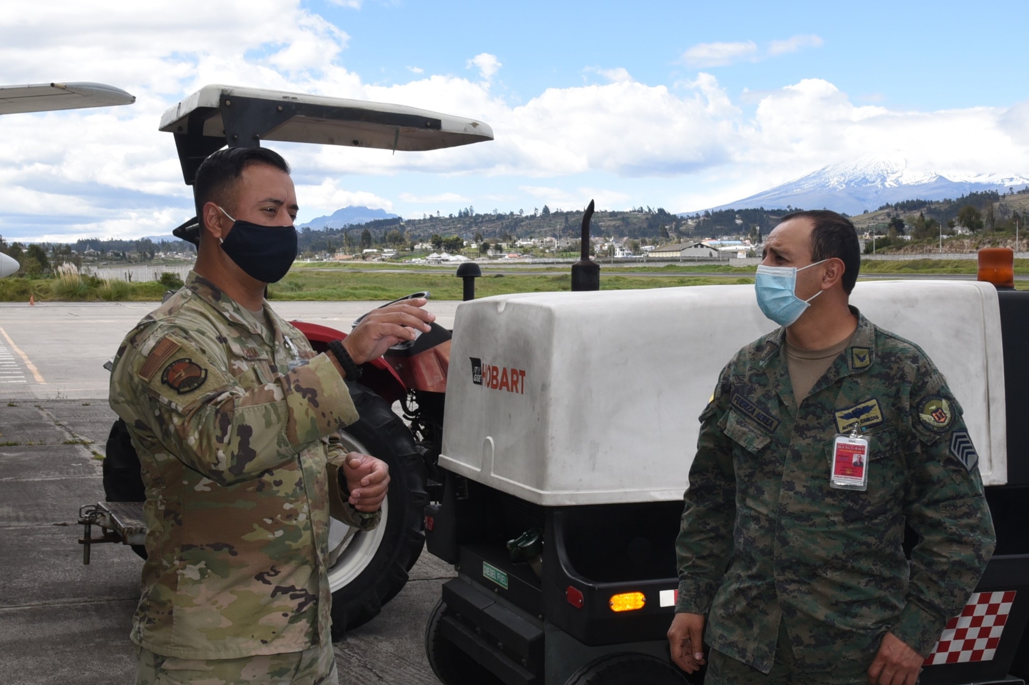 U.S. Air Force Tech. Sgt. Luis Ochoa, 571st Mobility Support Advisory Squadron vehicle management lead air advisor, shares his vehicle maintenance expertise with members of the Fuerza Aérea Ecuatoriana by discussing the complex structure to support air forces at any level July 16, 2020, at Cotopaxi Air Force Base in Latacunga, Ecuador. (U.S. Air Force photo by Master Sgt. Freddy Muñoz)