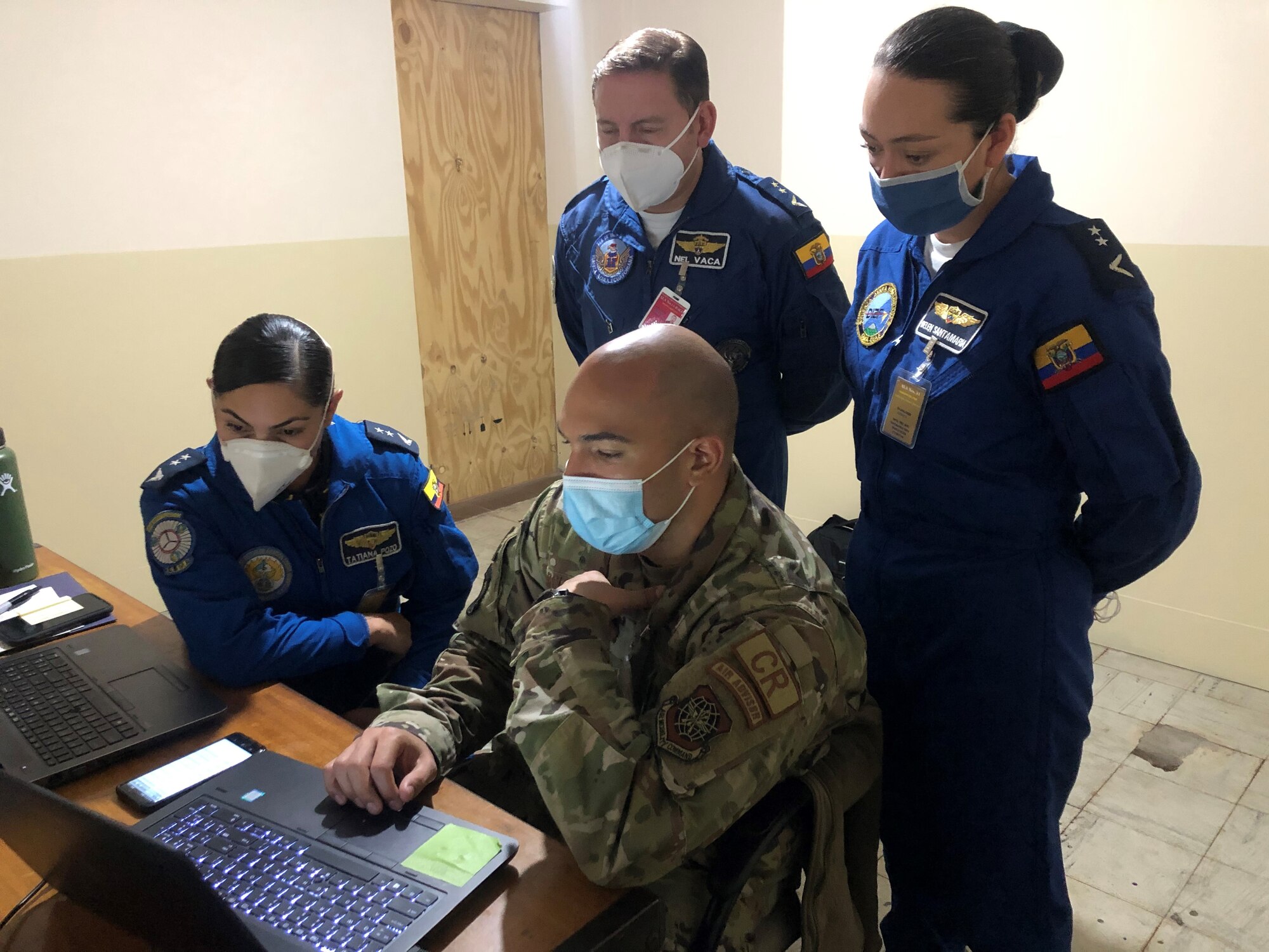 U.S. Air Force Tech. Sgt. James Garcia Arvelo, 571st Mobility Support Advisory Squadron materiel management lead air advisor, demonstrates supply systems up close with members of the Fuerza Aérea Ecuatoriana July 22, 2020, at Cotopaxi Air Force Base in Latacunga, Ecuador.  (U.S. Air Force photo by Capt. Kaitlin Morones)