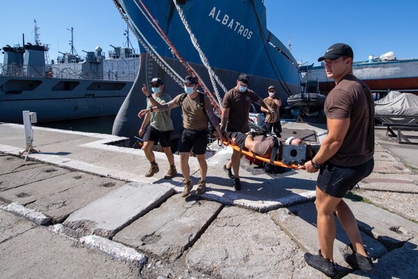 200803-N-RH019-0006 CONSTANTA, Romania, (Aug. 3, 2020) United States Navy Explosive Ordinance Disposal Mobile Unit 8 conducts emergency evacuation procedures during Eurasian Partnership Mine Countermeasures (EP MCM) 2020 exercise, August 3, 2020. The drill was to test evacuation from a Rigid Hull Inflatable Boat. EPMCM is a multi-lateral engagement with U.S., Romanian and Bulgarian forces, focused on enhancing mine countermeasure operations in the Black Sea, while strengthening interoperability between allied forces. U.S. 6th Fleet, headquartered in Naples, Italy, conducts the full spectrum of joint and naval operations, often in concert with allied, joint, and interagency partners, in order to advance U.S. national interests and security and stability in Europe and Africa. (U.S. Navy photo by Mass Communication Specialist 2nd Class Sean Rinner)